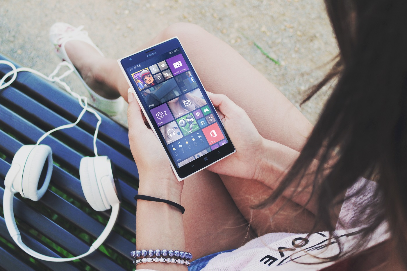 Woman Holding a Windows Device